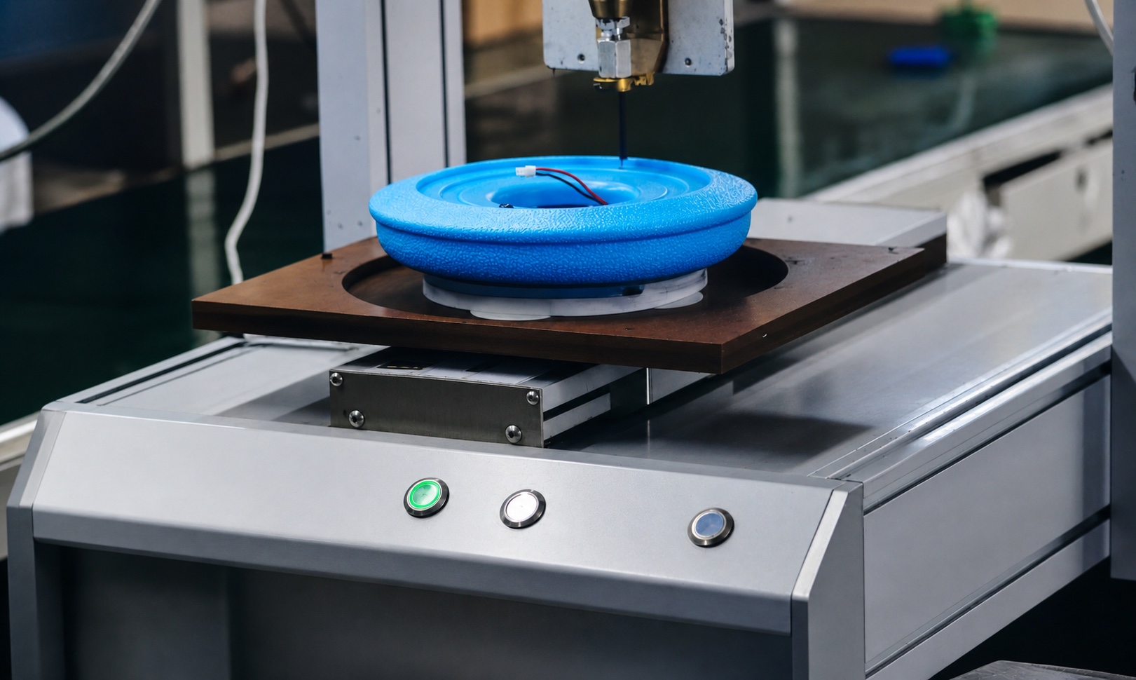 Automated dispensing equipment filling resin into a product housing during potting
